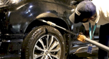 naspro-crew-removing-dirt-from-undercarriage-using-pressure-washer
