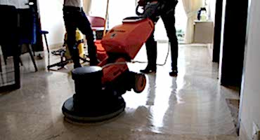 npc-professional-using-scrubbing-machine-to-restore-marble-floor