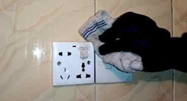 cleaning-professional-removing-dirt-and-grimes-from-switch-board-in-home-deep-cleaning-service